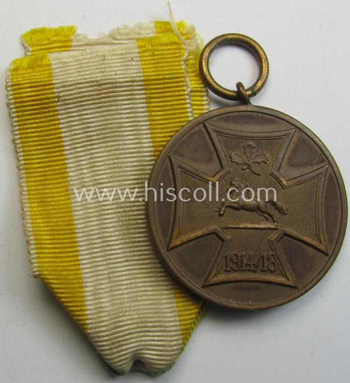 Attractive, (post)WWI-period - and neatly golden-bronze-toned! - so-called: 'Kriegsdenkmünze des Hannoverschen Landes-Kriegerverbandes' being a nicely preserved example that comes mounted onto its period ribbon (ie. 'Bandabschnitt')