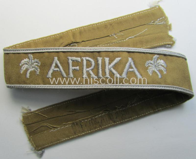 Superb - and simply never worn! - WH cuff-title (ie. 'Ärmelstreifen') entitled: 'Afrika' being a full-length example that shows an inked: 'RbNr.0/0256/2340'-numeral and that comes in an overall very nice- (ie. 'virtually mint') condition