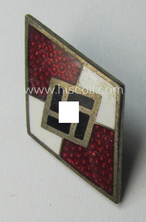 Scarcely found, HJ (ie. 'Hitlerjugend') enamelled pin (ie.: 'Raute') as was specifically intended for insertion into the 'HJ-Fahrtenmesser' being a bright-red-coloured example showing an: 'RzM - M1/174'-makers'-designation on its back