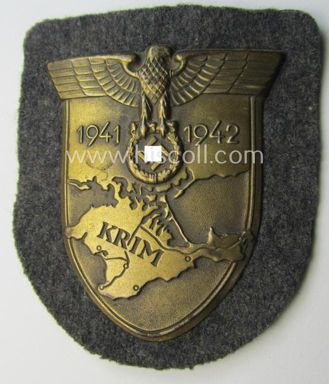 Attractive - albeit minimally stained - WH (Luftwaffe) 'Krim'-campaign-shield (as was produced by a by me unidentified maker) and that comes in a presumably issued - albeit still 'virtually mint', condition