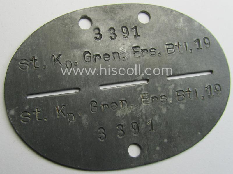 Neat - typical zinc-based and nicely preserved! - WH (Heeres ie. 'Panzer-Grenadiere') ID-disc (ie. 'Erkennungsmarke') bearing the clearly stamped unit-designation that simply reads: 'St.Kp.Gren.Ers Btl. 19'