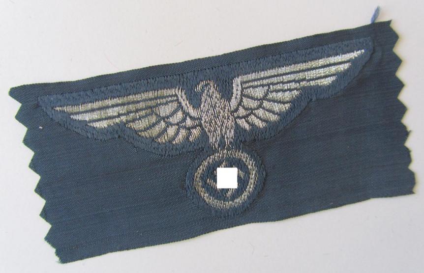 Attractive, BZP (ie. 'Bahnschutz-Polizei') officers'-/ie. NCO-type side-cap (ie. 'Schiffchen') eagle, as executed in woven silver thread (ie. 'flatwire-style') on a greyish-blue-coloured- and linnen-based background 