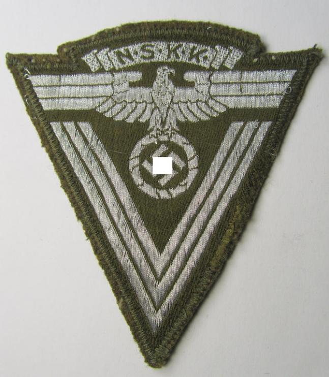 Unusally seen - and actually scarcely encountered! - N.S.K.K. (ie. 'National Socialistisches Kraftfahr Korps') so-called: 'N.S.K.K.-Ärmelabzeichen' showing a combined arm-eagle and/or chevron and period-attached 'RzM-etiket'