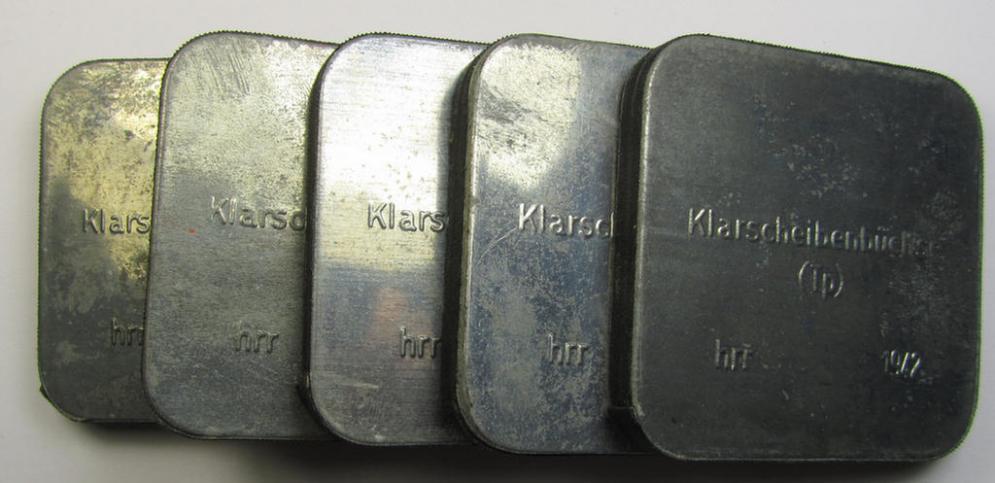 Unusal WH-equipment-item: a metal-based, square-sized box holding a pair of replacement gasmask-lenses for tropical-usage (ie. 'Klarscheibenbüchse - Tp') being a mint- ie. unissued example that bears a 3-digit maker-code ('hrr') and/or date: '1942'