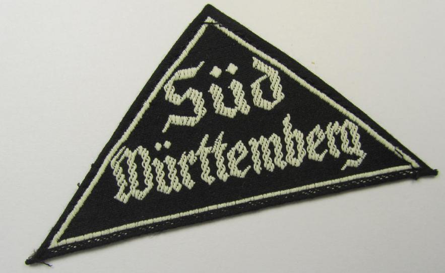 Attractive, 'HJ' ('Hitlerjugend') ie. 'BDM' ('Bund Deutscher Mädel'-) district-triangle (ie. 'Gebietsdreieck') entitled: 'Süd Württemberg' (being a never worn example that still retains its period-attached 'RzM'-etiket)