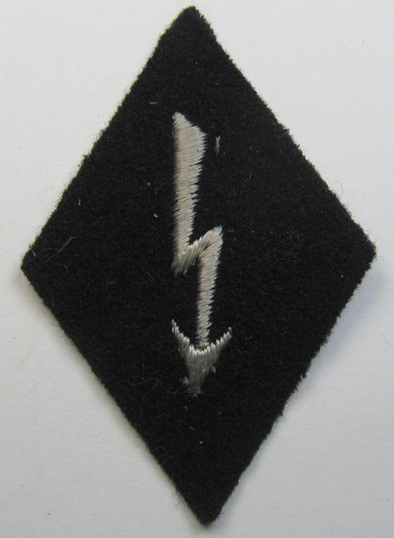 Neat, Waffen-SS-pattern-, machine-embroidered and black-coloured sleeve-insignia (ie. 'Ärmelraute') depicting a so-called: 'Signalblitz', as was used and intended to signify membership within a: 'Waffen-SS Nachrichten'-unit