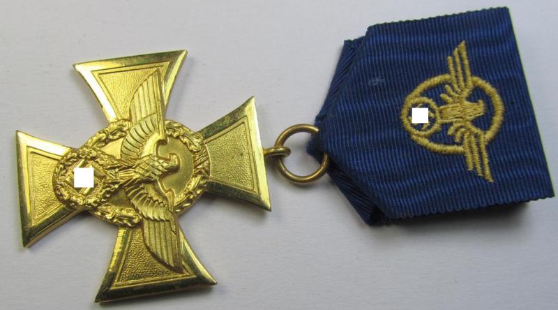 Attractive, golden-class 'Polizei-Dienstauszeichnung 1. Stufe' (or: police loyal-service medal first-class) being a non-maker-marked example that comes mounted onto its accompanying (long-sized!) ribbon (ie. 'Bandabschnitt')