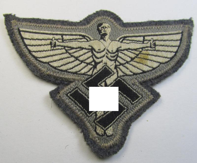 Attractive, bluish-grey-coloured, so-called: N.S.F.K.- (or: 'National Socialistisches Flieger Korps') breast-eagle being a nicely BeVo-woven- (and enlisted-mens'-pattern) example that comes mounted on its piece of bluish-coloured wool