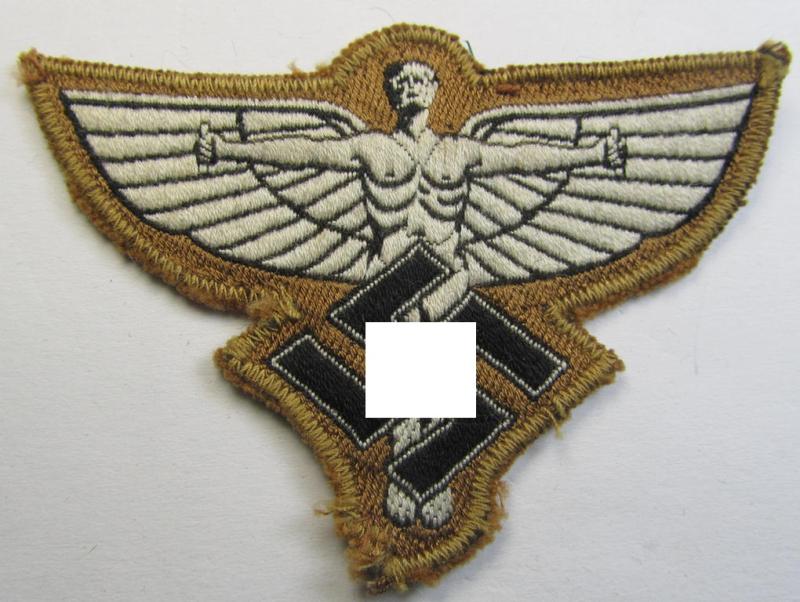 Tan-coloured, so-called: N.S.F.K.- (or: 'National Socialistisches Flieger Korps') breast-eagle being a nicely woven- (and enlisted-mens'-pattern) example that comes mounted on its piece of tan-coloured linnen