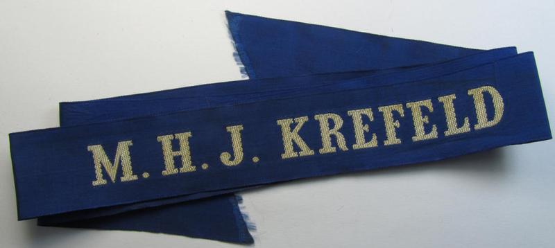 Superb - and with certainty very rarely encountered! - Marine-HJ (ie. 'Marine-Hitlerjugend') cap-tally (ie. 'Mützenband') entitled: 'M.H.J. Krefeld' (being a full-length example that comes in an overall nice condition)