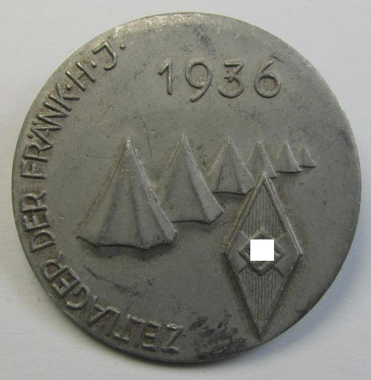 Commemorative - aluminium-based- and/or: greyish-silver-coloured-, 'HJ'-related 'tinnie', being a non-maker-marked example, depicting a 'HJ-Raute' surrounded by the text: 'Zeltlager der Frank. H.J. - 1936'
