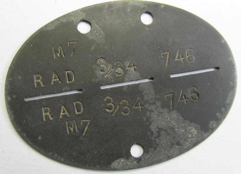 Neat - and fairly unusually found! - RAD (ie. 'Reichsarbeitsdienst') ID-disc being a typical greyish-coloured and zinc-based example bearing the stamped text ie. unit-designation that reads: 'RAD 3/34/746 M7'
