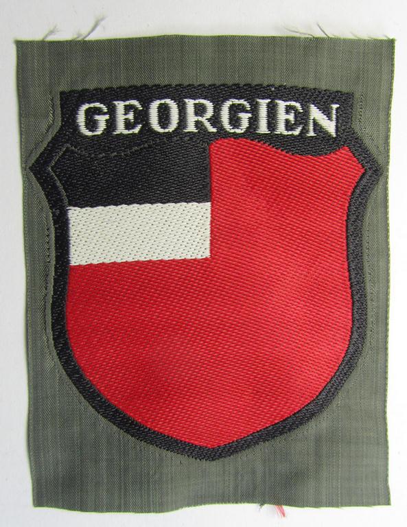 Attractive, 'BeVo'-type armshield entitled: 'Georgien' (being a 'virtually mint- ie. unissued' example as intended for a volunteer who served within the 'Deutsche Wehrmacht' ie. within the 'Georgisches Legion')