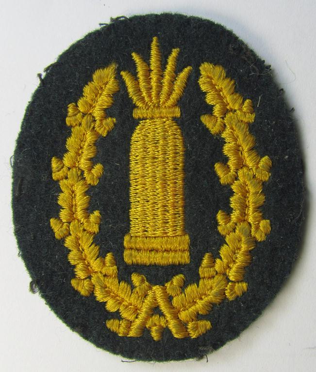 Neat - moderately used- and/or worn! - example of a WH (Heeres) 'Richtabzeichen für Artillerie-Richtkannoniere' (or: artillery gun-layers patch) as executed in the machine-embroidered-pattern (and that comes in a carefully tunic-removed condition)