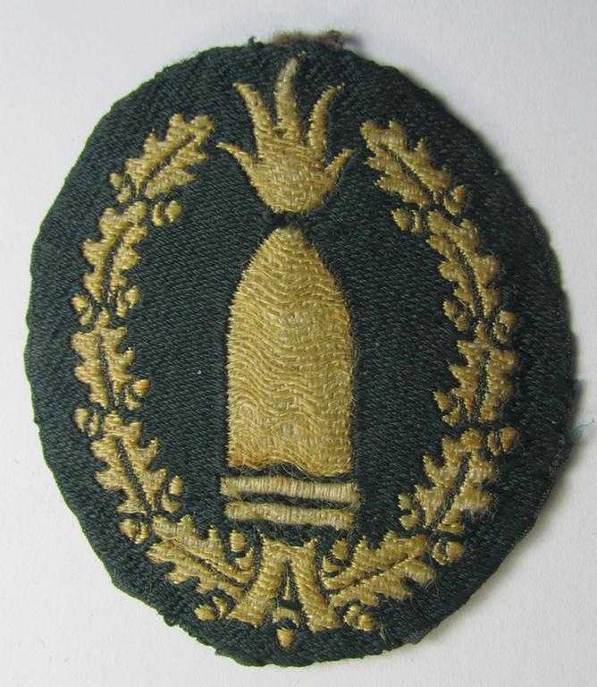 Neat - moderately used- and/or worn! - example of a WH (Heeres) 'Richtabzeichen für Artillerie-Richtkannoniere' (or: artillery gun-layers patch) as executed in neat 'BeVo-weave'-pattern (and that comes in a carefully tunic-removed condition)