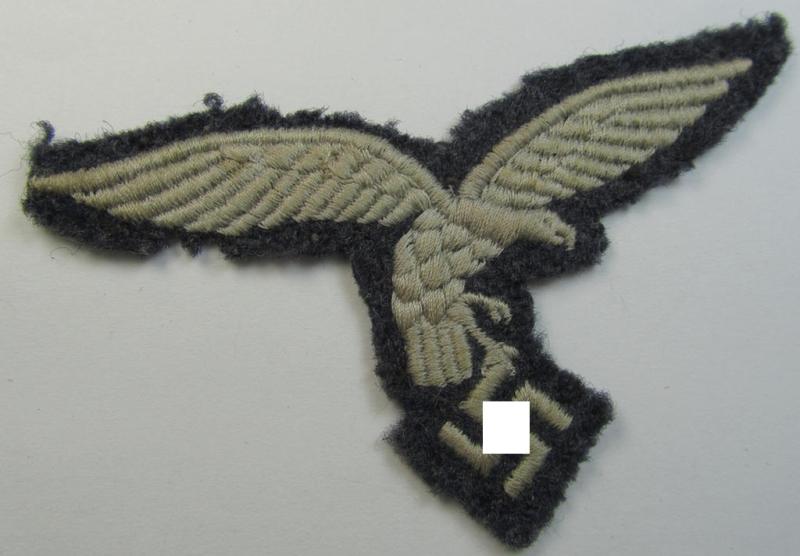 Moderately used- and/or tunic-removed, WH (Luftwaffe) EM- (ie NCO-) pattern, machine-embroidered breast-eagle (showing a 'down-tailed'-eagle and being an early- ie. pre-war-period example) that comes in a moderately used-, condition