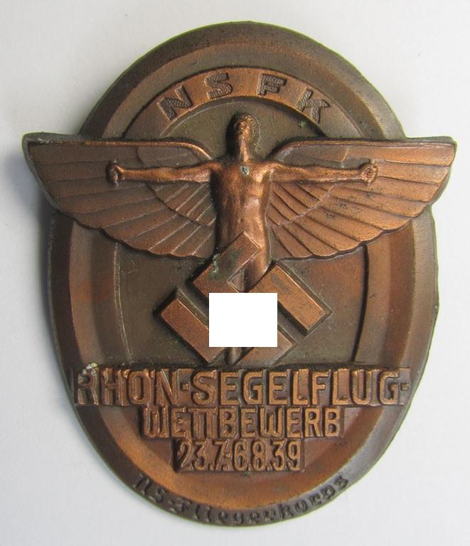 Copper-bronze-toned, N.S.F.K.-related day-badge (ie. 'tinnie') being a non-maker-marked example as was issued to commemorate a specific meeting ie. national rally entitled: 'N.S.F.K. Rhön-Segelflug Wettbewerb 23.7.-6.8.39'