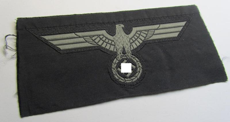 Later- (ie. mid-war-) period, WH (Heeres) 'Panzer'-type breast-eagle (ie. 'Brustadler für Panzertruppen') being a 'virtually mint- ie. unissued' example as executed in bluish-grey-coloured linnen on a black-coloured background