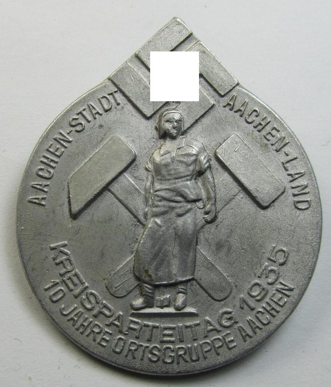 Attractive, bright silverish-toned- (and/or typical aluminium-based) N.S.D.A.P.-related day-badge (ie. 'tinnie' or: 'Veranstaltungsabzeichen') as issued to commemorate the: 'Kreisparteitag - Aachen-Stadt - Aachen-Land - 10 Jahre Ortsgruppe Aachen'