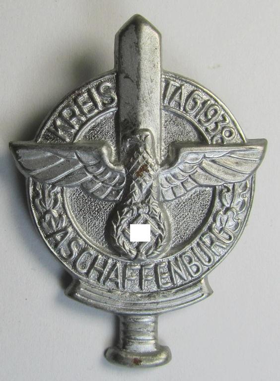 Attractive, bright silverish-toned- (and/or typical zinc-based) N.S.D.A.P.-related day-badge (ie. 'tinnie' or: 'Veranstaltungsabzeichen') as was issued to commemorate the: 'Kreisparteitag - Aschaffenburg - 1938'