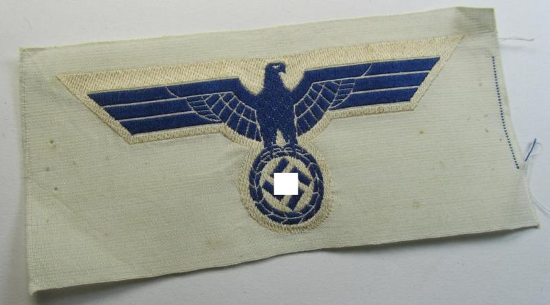 WH (KM) EM- (ie. NCO-) type breast-eagle (ie. 'Brustadler für Mannschaften u. Uffz. der Kriegsmarine') as executed in the 'BeVo'-weave-pattern on a white-coloured background as was specifically intended for usage on the various white-coloured tunics