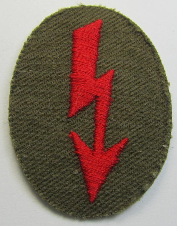 WH (Heeres) 'tropical-styled'-, trade- and/or special-career insignia (or: 'Signal Blitz') as was intended for a soldier within the: 'Artillerie-Truppen'