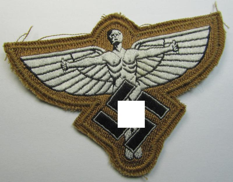 Tan-coloured, so-called: N.S.F.K.- (or: 'National Socialistisches Flieger Korps') breast-eagle being a nicely woven- (and enlisted-mens'-pattern) example that comes mounted on its piece of tan-coloured linnen