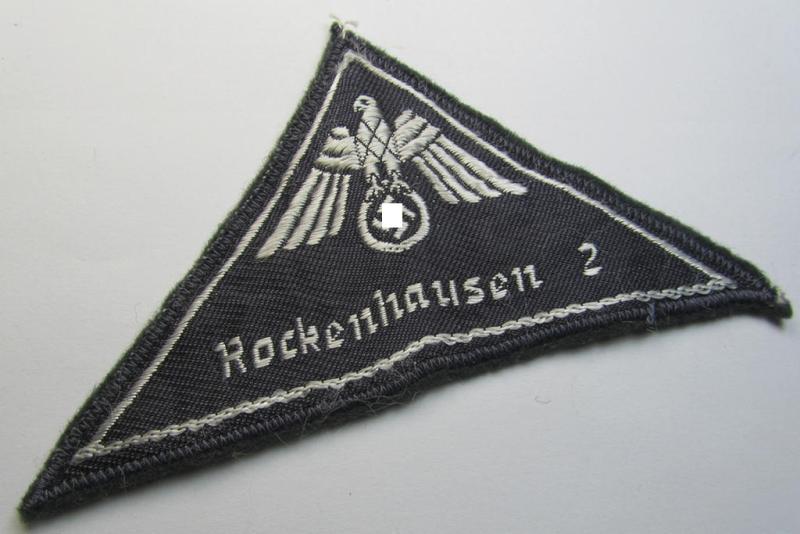 Attractive, German Red Cross (ie. 'Deutsches Rotes Kreuz' or 'DRK') greyish-coloured- and/or (typically) triangular-shaped arm-eagle entitled: 'Rockenhausen 2' as was executed in the neat 'BeVo'-weave pattern
