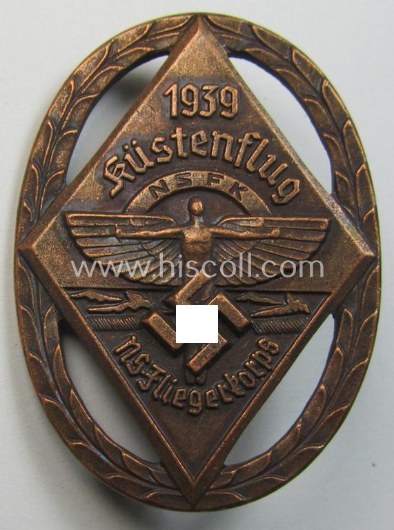 Reddish-bronze-toned, N.S.F.K.-related day-badge (ie. 'tinnie') being a non-maker-marked example as was issued to commemorate a specific meeting ie. national rally entitled: 'N.S.F.K. Küstenflug 1939'