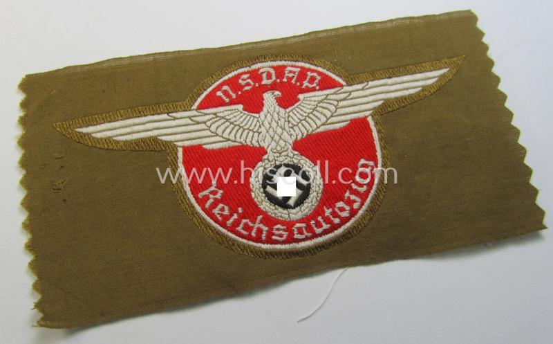 Superb - and rarely encountered! - breast-badge as executed in 'BeVo-weave' pattern as was intended for members within the 'N.S.D.A.P. Reichsautozug' (or: 'RaZ') still retaining its period, paper-based 'RzM'-etiket