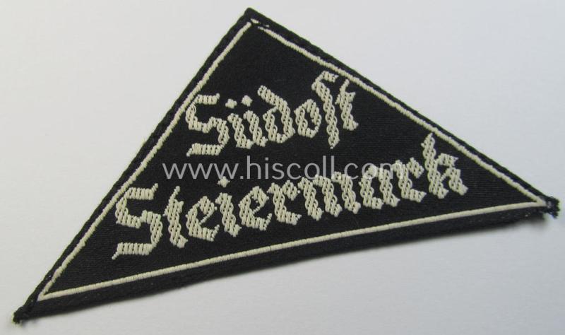 'HJ' ('Hitlerjugend') ie. 'BDM'- ('Bund Deutscher Mädel') district-triangle (ie. 'Gebietsdreieck') entitled: 'Südost Steiermark' (being a simply never used- nor worn example that still retains its period-attached 'RzM'-etiket)