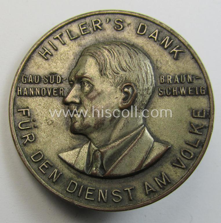 Commemorative, silvered 'Buntmetall'-based N.S.D.A.P.- (ie. WHW-) related 'tinnie' being a maker- (ie. 'Paulmann u. Crone'-) marked example depicting A.Hitler and text: 'Hitlers' Dank für den Dienst am Volke - Gau Süd-Hannover - Braunschweig'