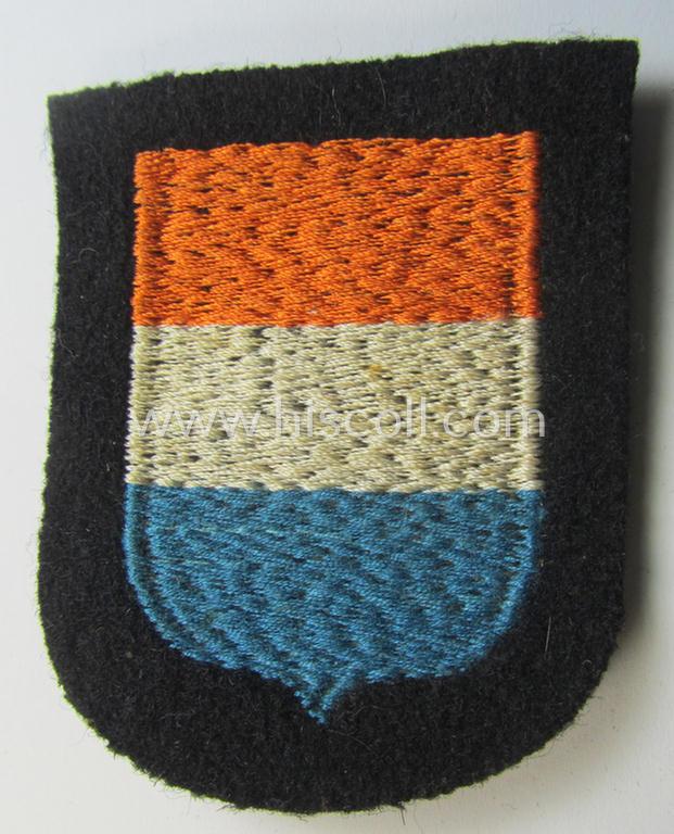 Dutch, Waffen-SS 'volunteer' arm-shield as was specifically intended for usage by soldiers of the: '23. SS Freiwilligen Panzer Grenadier Division' ('Nederland') that comes in a 'virtually mint- ie. unissued', condition