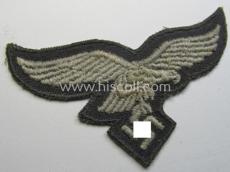 Neat, 'variant'-pattern, WH (Luftwaffe) EM- (ie. eventually NCO-) type side-cap eagle (being a 'virtually mint- ie. unissued' example as executed in typical machine-embroidered-pattern onto an unusally seen 'thin-shaped' background)