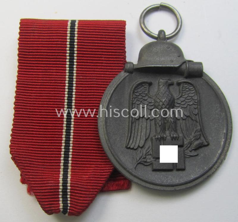 Attractive medal-set: 'Winterschlacht im Osten 1941-42' being a non-maker-marked- (and/or 'Feinzink'-based) specimen and that comes together with its (minimally confectioned) ribbon (ie. 'Bandabschnitt')