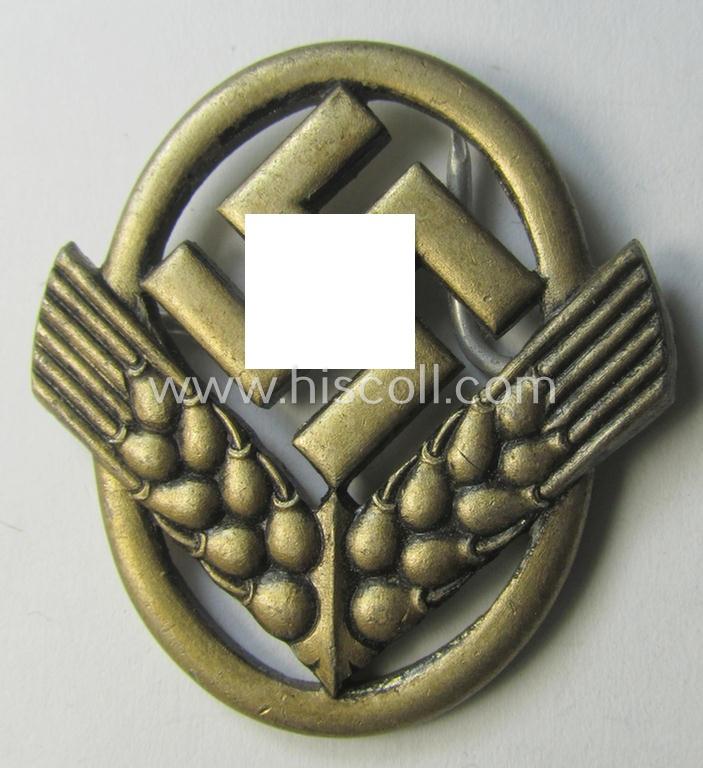 Attractive - and scarcely encountered! - silverish-golden-toned - and I deem aluminium-based - cap-badge (ie. 'Hutabzeichen') as was intended for usage by a female member serving within the: 'Reichsarbeitsdienst der weiblichen Jugend' (or: RADwJ)