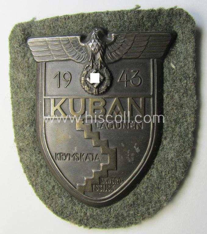 Attractive - and actually scarcely encountered! - WH (Heeres ie. Waffen-SS) 'Kuban'-campaign-shield that comes mounted onto its original field-grey-coloured- and/or woolen-based 'backing'