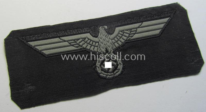 Neat, WH (Heeres) later- (ie. mid-war-) period- and/or bluish-grey-coloured 'Panzer'-type side-cap-eagle a executed in the neat 'BeVo'-weave pattern on a black-coloured background