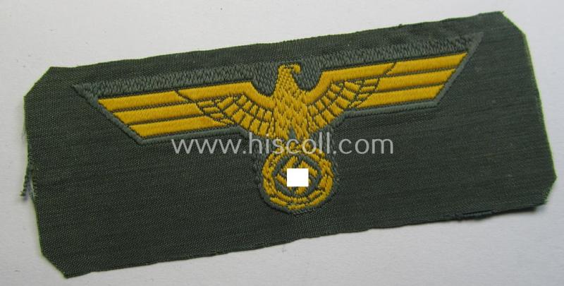 WH (Kriegsmarine o. Küsten-Artillerie) early- (ie. mid-war-) period- and/or golden-yellow-coloured WH (Heeres) type side-cap-eagle as executed in the neat 'BeVo'-weave pattern onto a field-grey-coloured background