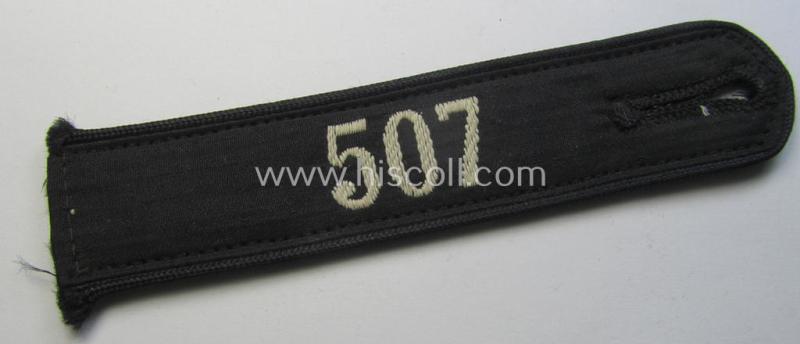 Neat - and naturally single! - black-piped 'DJ- o. Deutsches Jungvolk' shoulderstrap as was intended for usage by a: 'DJ-Mitglied' who served within the: 'Bann 507' (507 = 'Wien-West') and that comes with its period-attached 'RzM'-etiket