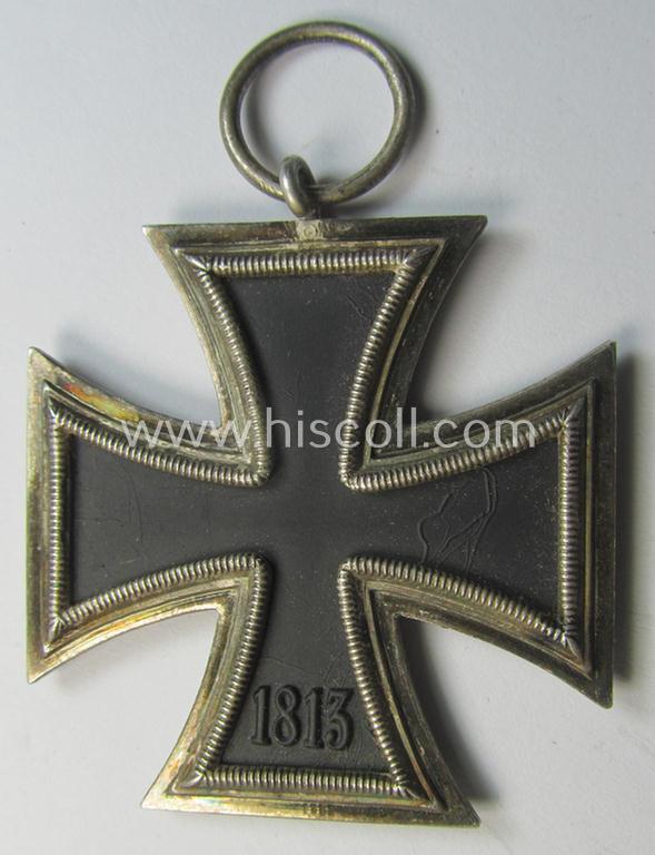 Attractive, 'Eisernes Kreuz II. Klasse' being a non-maker-marked example that comes together with its original- and once-mounted ribbon (ie. 'Bandabschnitt') as was (I deem) produced by the Austrian maker (ie. 'Hersteller'): 'Friedrich Orth'