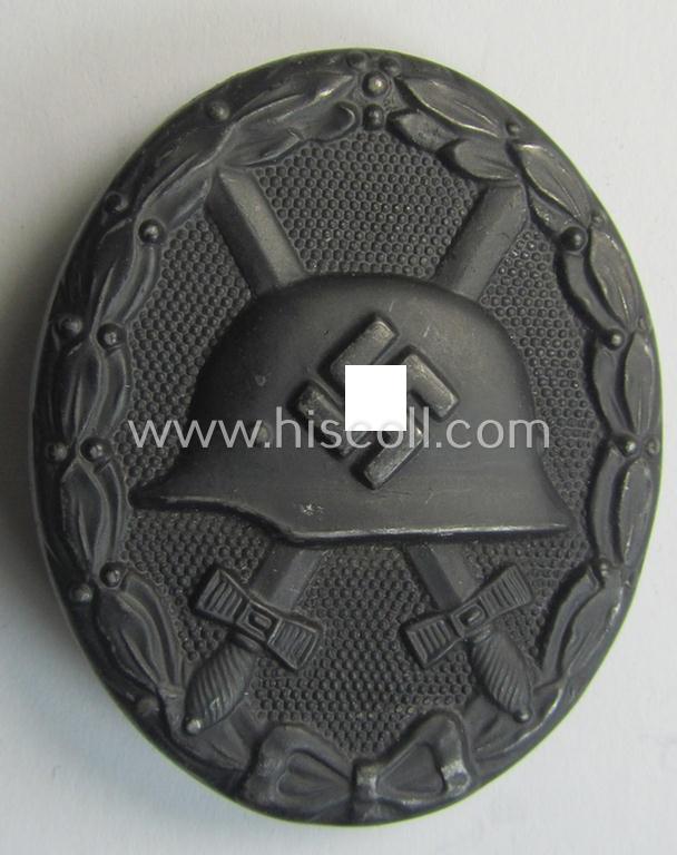 Neat, black-class wound-badge (or: 'Verwundeten-Abzeichen in Schwarz') being a neatly maker- (ie. '65'-) marked example that was produced by the maker (ie. 'Hersteller') named: 'Klein & Quenzer'