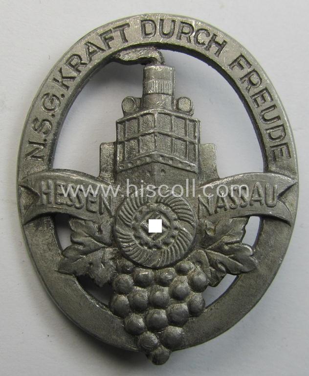 Attractive, so-called: 'KdF'- ('DAF- o. Kraft durch Freude'-) related day-badge (ie. 'tinnie') depicting a ship, grapes and 'DAF-Zahnrad'-logo coupled with the text that reads: 'N.S.G. Kraft durch Freude - Hessen-Nassau'