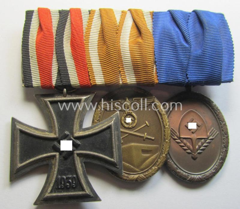 Superb, 3-pieced WII-period medal-bar (ie. 'Ordenspange') showing respectively an: 'Eisernes Kreuz II. Kl.', a: 'Deutsches Schutzwall Ehrenzeichen' (aka: 'Westwall'-medal) and a: 'RAD-DA 4. St. für Männer'