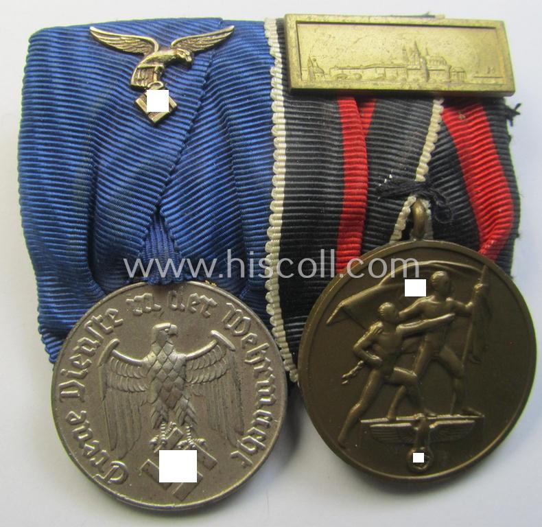 Superb example of a two-pieced WH (Luftwaffe) medal-bar (ie.: 'Doppelspange') resp. showing a: 'WH-DA 4. Stufe' and a Czech 'Anschluss'-medal that comes with a firmly attached 'Prager Burg-Spange'