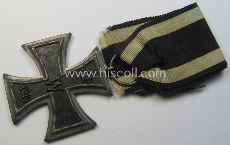 Attractive, WWI-period: 'Eisernes Kreuz II. Klasse' (or: iron cross second class) being a neatly maker- (ie. 'KO'-) marked example that comes mounted onto its confectioned (and longer-sized!) ribbon (ie. 'Bandabschnitt')