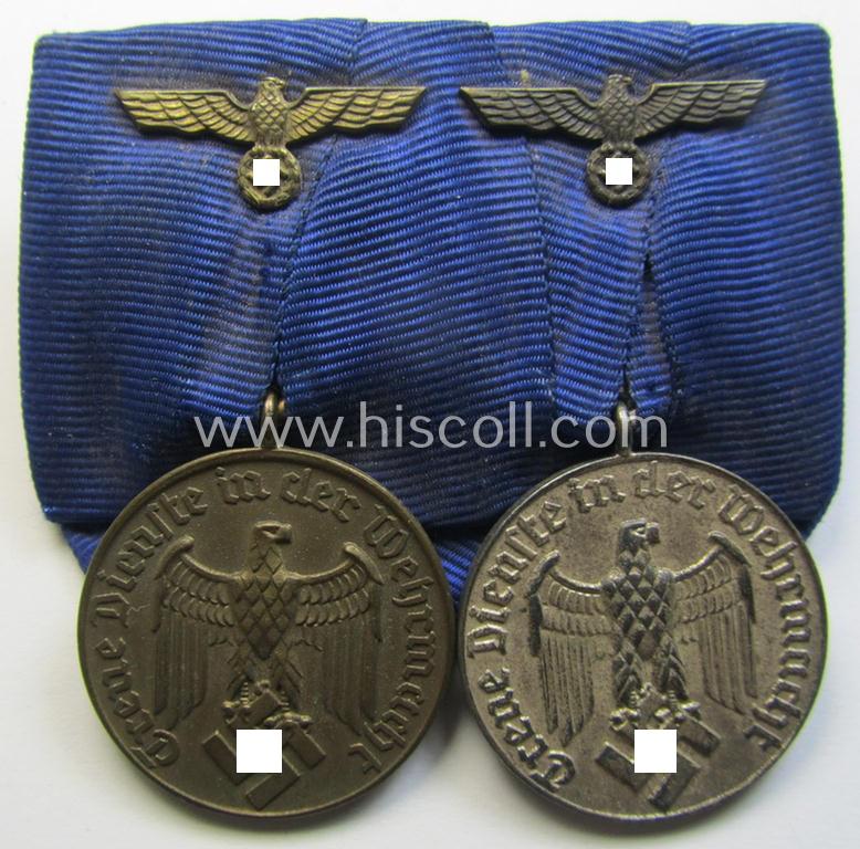 Attractive, two-pieced medal-bar (ie. 'Spange') showing two: WH (Heeres o. Kriegsmarine) so-called: 'Dienstauszeichnungen für 4 u. 12 Jahre Treue Dienste' that both come period-mounted as a so-called: 'Doppelspange'