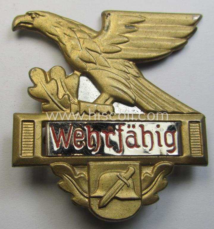 Commemorative, WHW- (ie. 'Winterhilfswerke'-) related 'tinnie' being a non-maker marked example depicting a 'Reichsadler', steel-helmet and sword and showing the text: 'Wehrfähig'