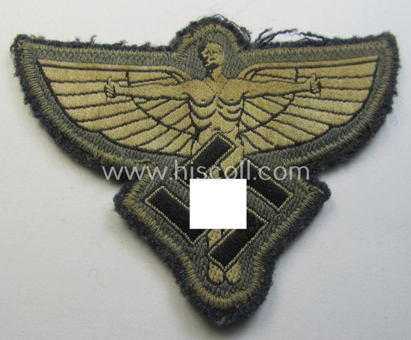 Attractive, bluish-grey-coloured, so-called: N.S.F.K.- (or: 'National Socialistisches Flieger Korps') breast-eagle being a nicely BeVo-woven- (and enlisted-mens'-pattern) example that comes mounted on its piece of bluish-coloured wool