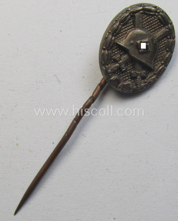 Neat - and 17 mm. sized! - miniature lapel-pin (ie. 'Halbminiatur') depicting a: 'Verwundeten-Abzeichen in Silber' (or: silver-class wound-badge) being a maker- (ie. 'L/54'-) marked example as executed in silver-coloured metal